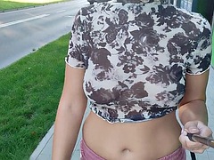I show my tits while I walk through the city streets.