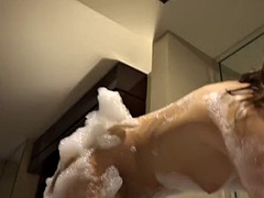 Molly is really playful in the bathtub with all the bubbles, so you decide to join her