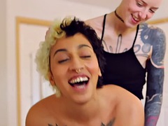 Tattooed amateur lesbians in sensual vaginal sex with strapon