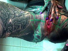 Watch this tattooed alternative girl get off with enema play in the shower