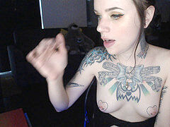 tattooed webcam damsel inhales and gags on dildo