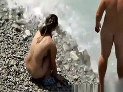 Mutual masturbation on a nude beach