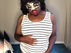 Chubby crossdresser in mask plays with tits and twerks