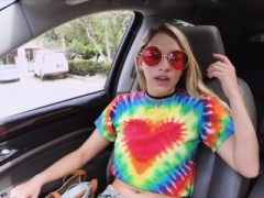 Sexy hippie blows phallus on front seat