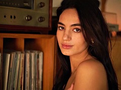 Petite and beautiful Latina model Sarah Mollica strips naked at home for Playboy