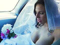 A dame gets penetrated in her wedding gown on the bed