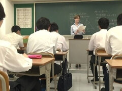 Young Japanese teacher helps her student