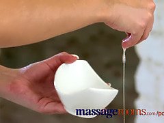Rita Peach's oiled up feet and big tits get rubbed during a steamy massage session