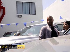 Kazumi, the busty brunette, gets rough fucked in front of the customers at car dealership