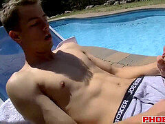 mischievous youngster jack Washington jerking off his cock by the pool