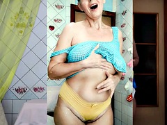 Perky Lukerya, as usual, is engaged in erotic cleaning in a transparent mesh on big hanging tits in yellow panties.