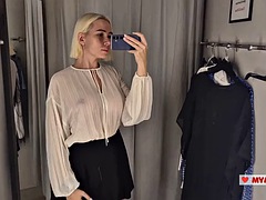 Trying on transparent clothes with huge tits in the dressing room