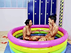Romana Ryder and Tammia Lee in a pool filled with strawberry jelly