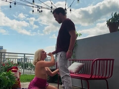 Blonde blows her man on the balcony and rides his hard cock
