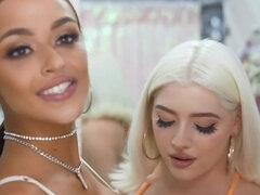 Blonde seduces busty Latina girlfriend in the changing room