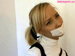 cute innocent teenager doll hogtied and tape gagged
