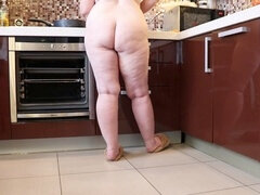 Busty mature plumper caught on hidden cam in the kitchen showing off her plump legs