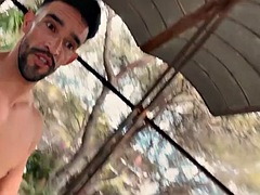 Fitness man walks completely naked in an abandoned building