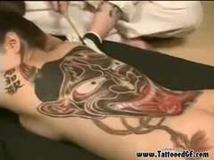 Tattooed Japanese geisha sucking rock hard-on and pounded rear end