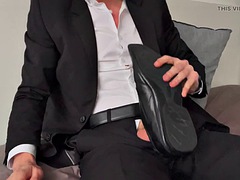 A guy in a suit fucks his shoes
