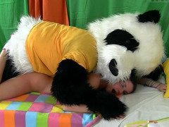 Hot female is getting fucked by a man that is in a panda costume