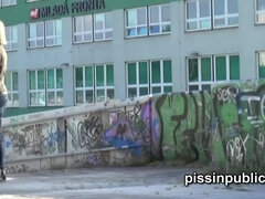 Czech girls get caught pulling their pants and peeing at a bus stop