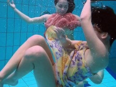 A pair of hot lesbians in the pool loving eachother