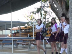 Hot chick in a schoolgirl outfit is giving a sexy show for us