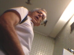 Voyeur films old males in the public restroom