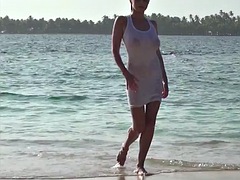 Ewa shows off one of her tits on the beach