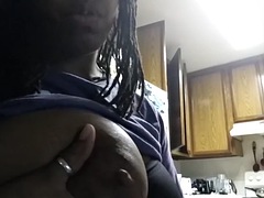 Ebony squeezes milk out of her big black breasts for Youtube