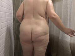 Spying on a voluptuous mature woman in the shower. Mature big beautiful woman cleans her juicy booty, large breasts, and bushy vagina. Amateur voyeuri