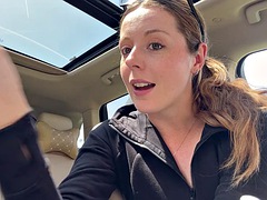 Masturbating with a pink dildo in the back seat of a car