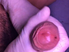 Uncut cock close up and cum in latex gloves in slow motion at the end