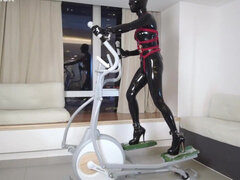 Mz27 - a Girl Bound in Latex Walks on a Treadmill