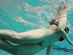 Tattooed baby swirls underwater