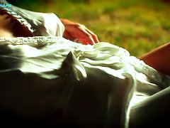 Sandra Romain smokes a cigarette and strokes in the park