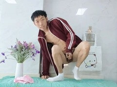 Cute Asian boy in a private kitchen getting off on a beautiful afternoon