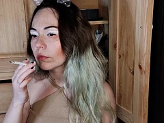 Modest stepsister smokes a cigarette