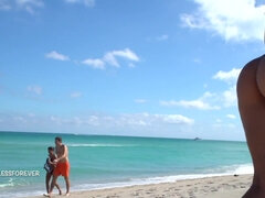 Nasty MILF shows her hot boobs on the beach